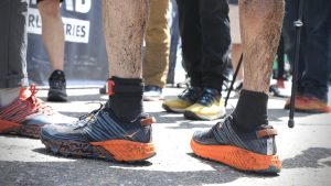 Hoka Speedgoat 4 - race finish line in mud - feature