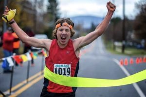 A young Zach Miller breaking the tape at the 2013 JFK 50 Mile