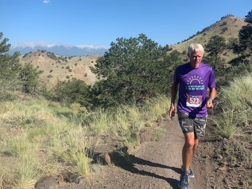 Mark Macy running a trail race iRunFar