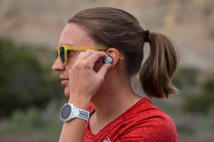 Best Running Headphones - putting in the Jabra Elite 7 Active