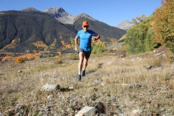 Bryon Powell running in Altra Lone Peak trail shoes