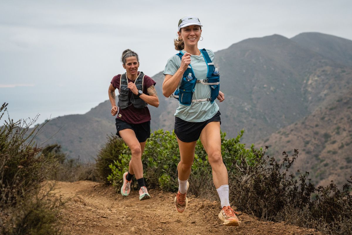 Best Running Vest - two runners wearing running vests smiling on California mountain trail