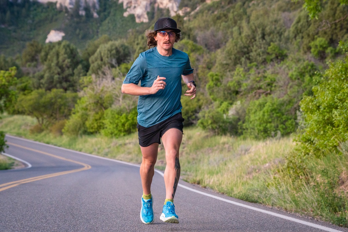 Best Gifts for Runners - runner in the Hoka Clifton 10 on mountain road