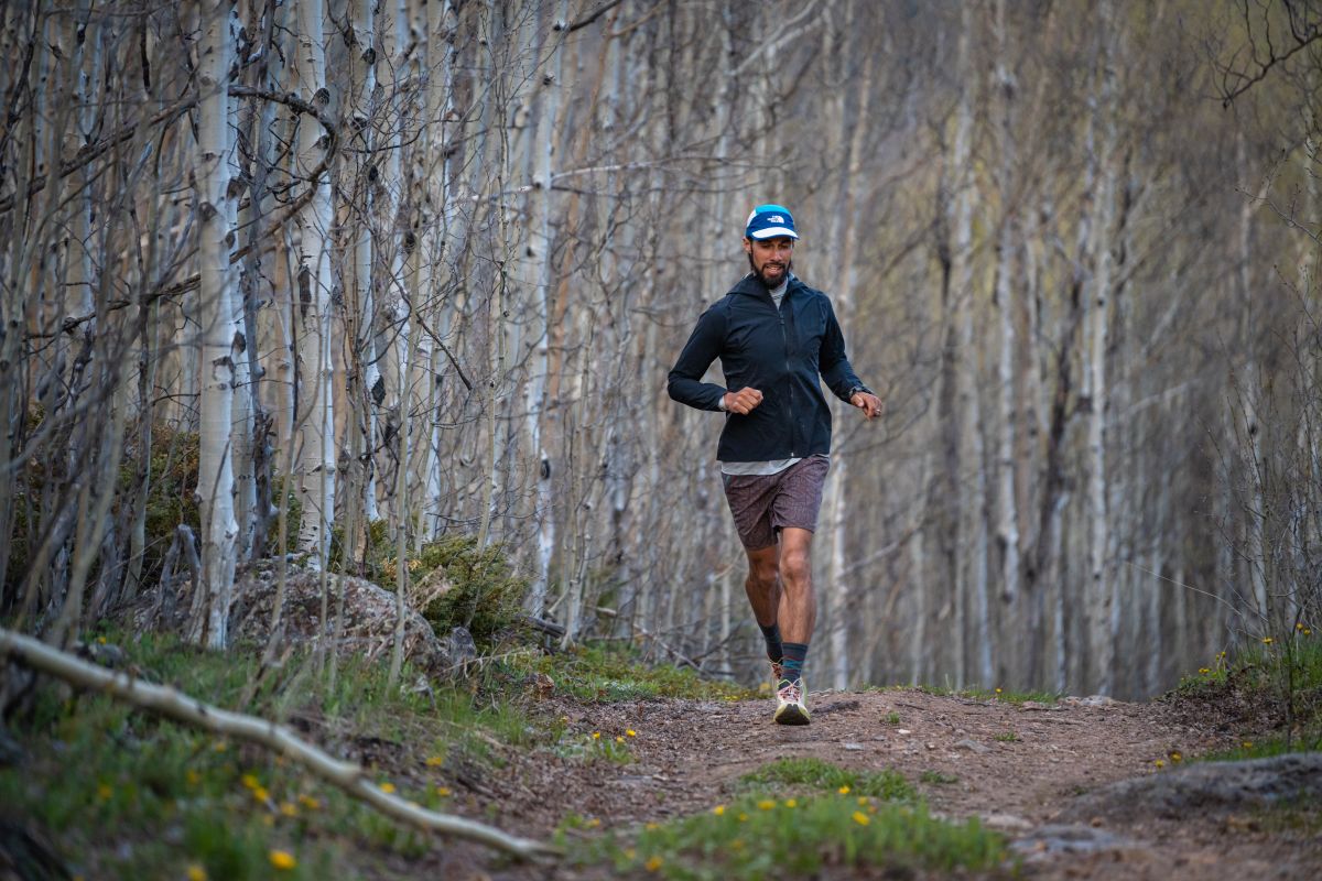 Best Running Hats - runner in the The North Face Lightrange Summer Run Hat on wooded trail