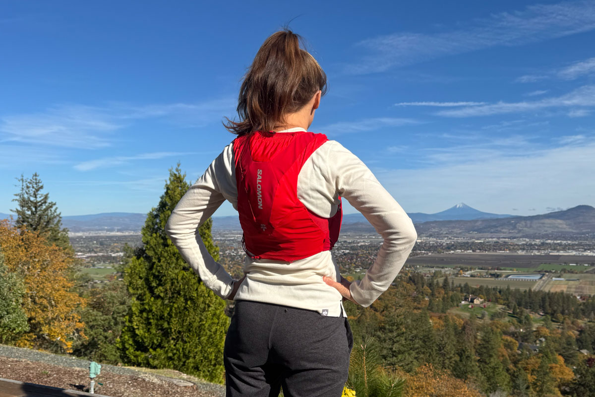 Person outside wearing a hydration pack viewed from behind