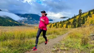 female trail runner testing trail shoes near Silverton Colorado