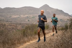 Best Road-to-Trail Shoes - two runners on desert gravel trail