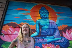 Lizzy Jones - in front of mural