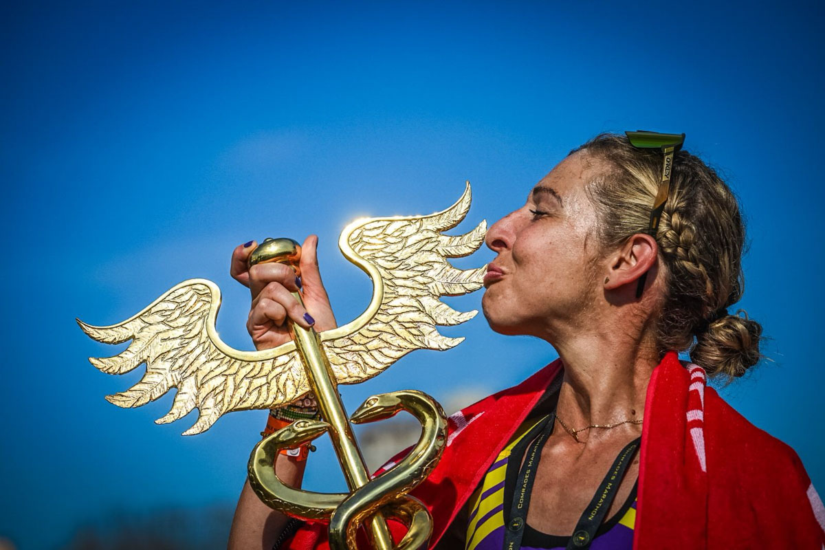 Gerda Steyn - 2026 Comrades Marathon women's winner kissing trophy