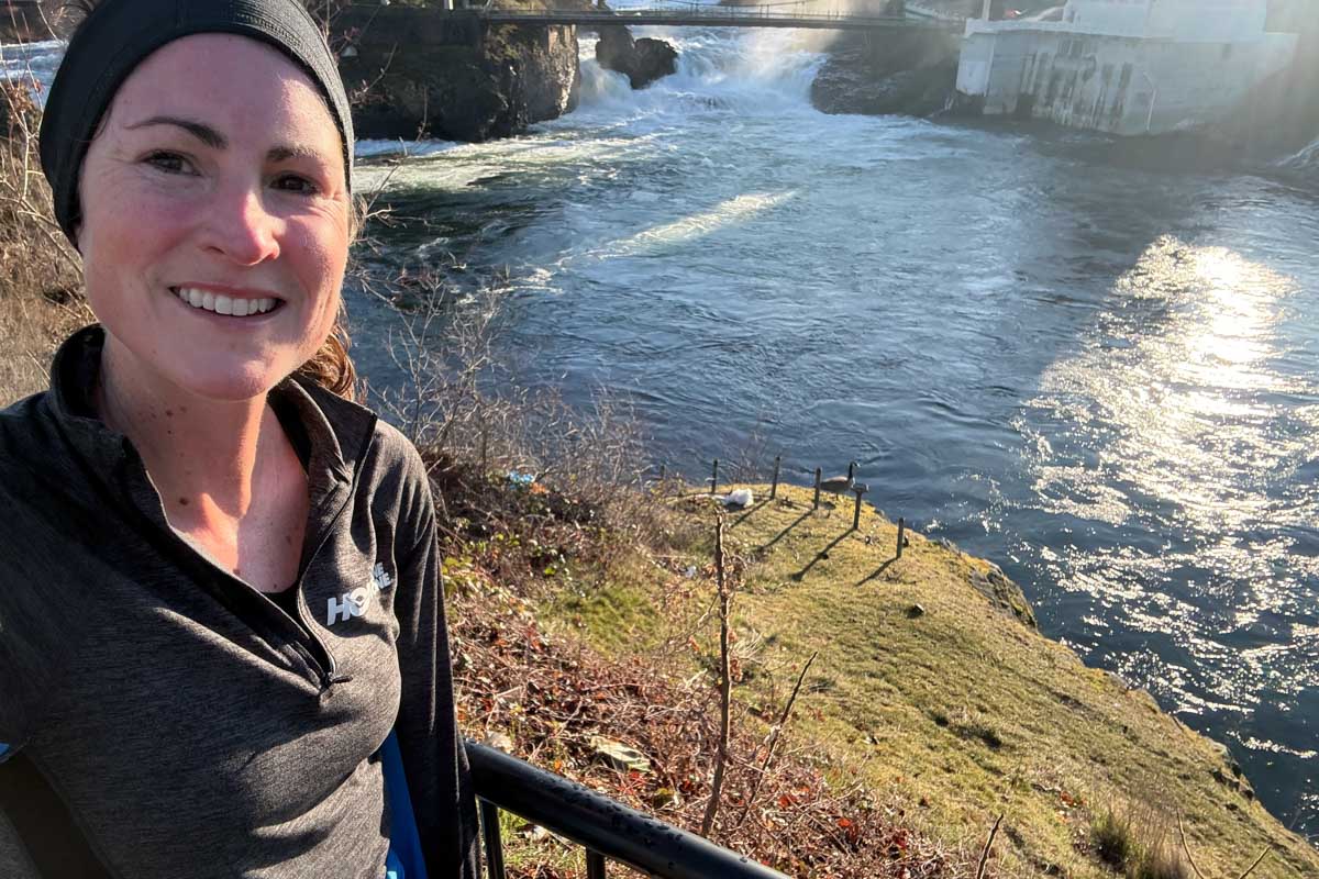 Sabrina Little running next to river