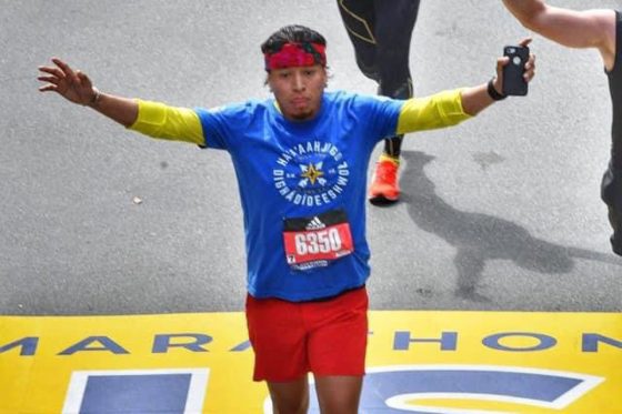Harold Bennally finishing the Boston Marathon