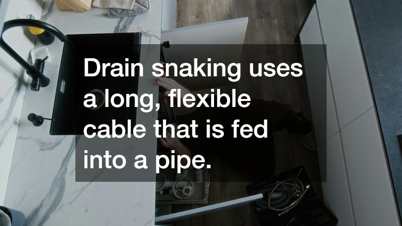 Drain snaking uses a long, flexible cable that is fed into a pipe.
