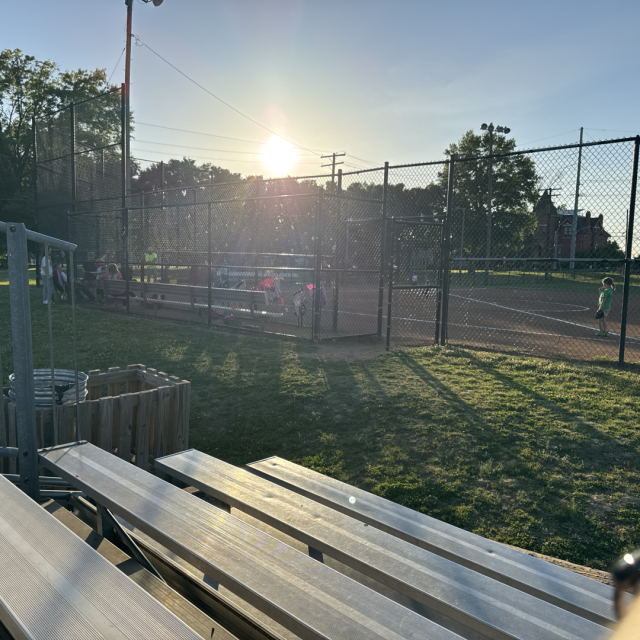Softball field near sunset with tiny players