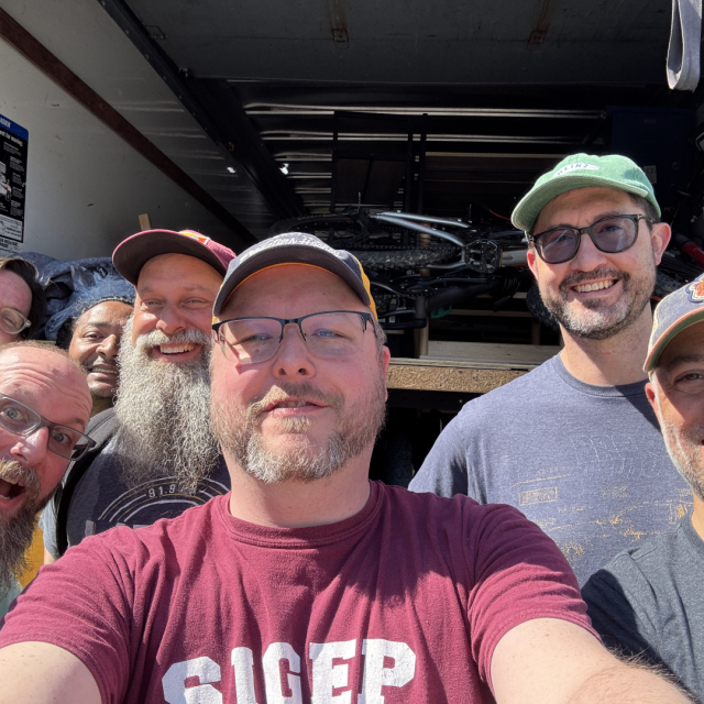 Group shot of people in front of a U-Haul