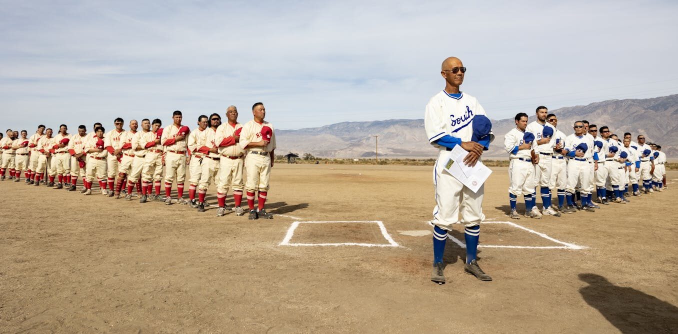 Baseball returns to a Japanese American detention camp after a historic ball field was restored