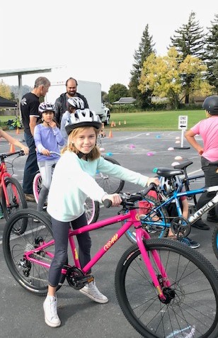 Girl on a bike at a Bay Area Bike Project event