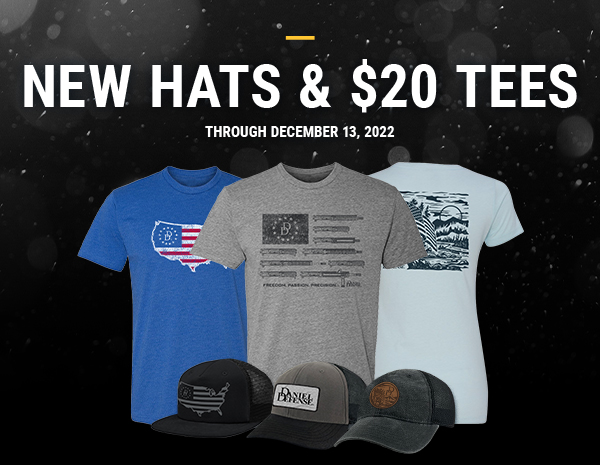 Three t-shirts behind three hats on a dark, snowy background.