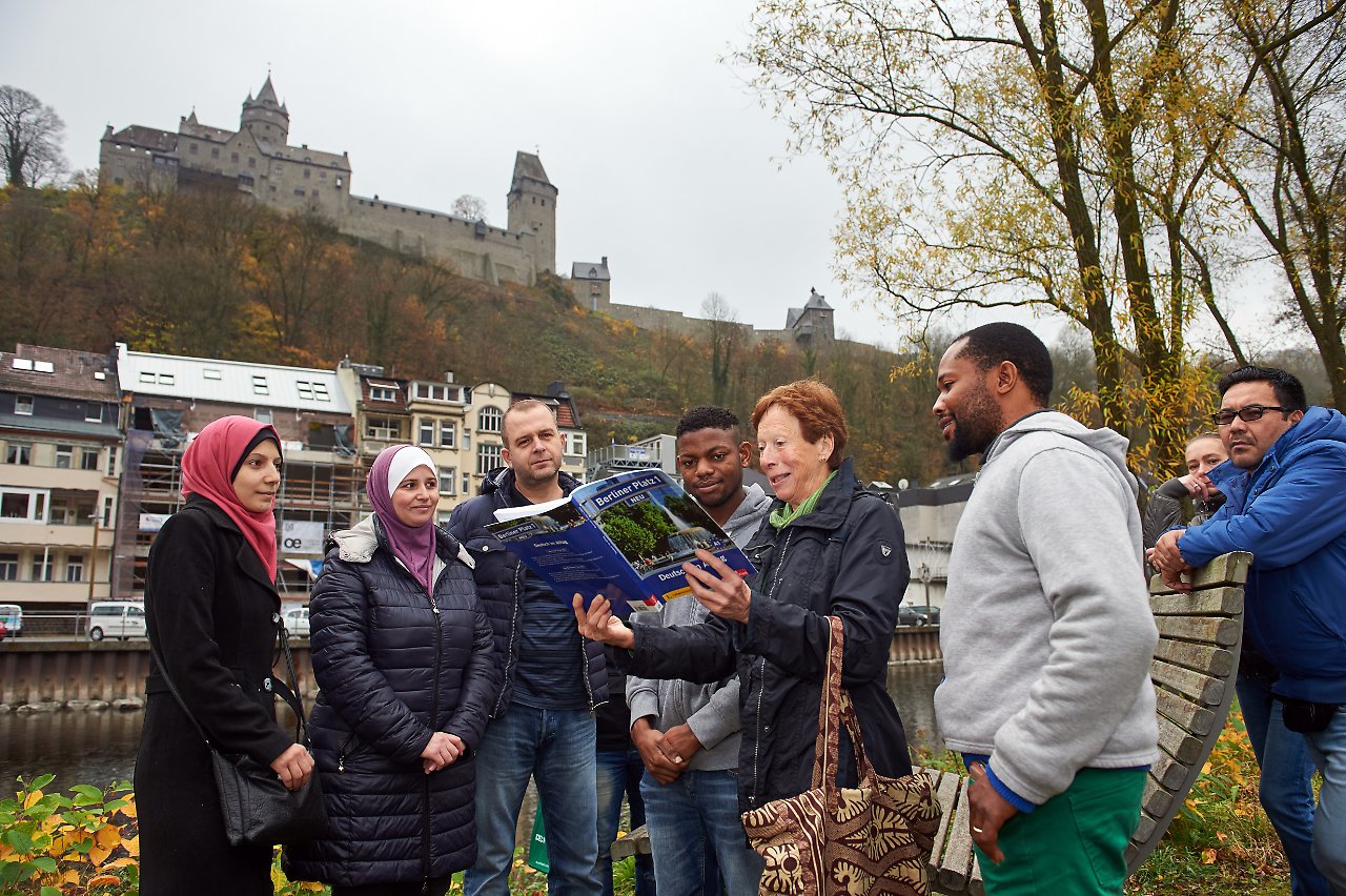 Migrants and a volunteer from Altena's Kümmerer programme Migrants and a volunteer from Altena's Kümmerer programme