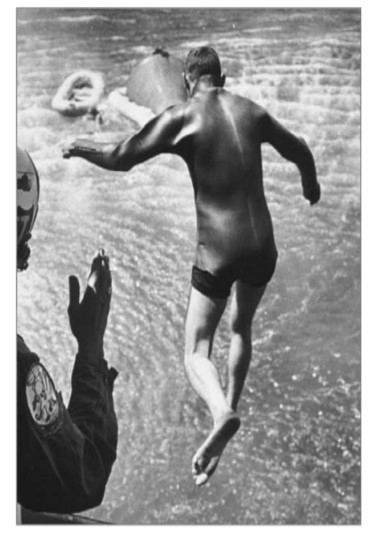 Carpentier practicing for recovery of astronauts from a water landing. Carpentier practicing for recovery of astronauts from a water landing.