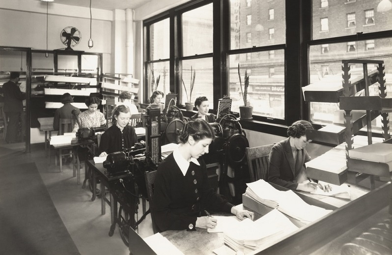 Old picture of workers in an administrative office Old picture of workers in an administrative office