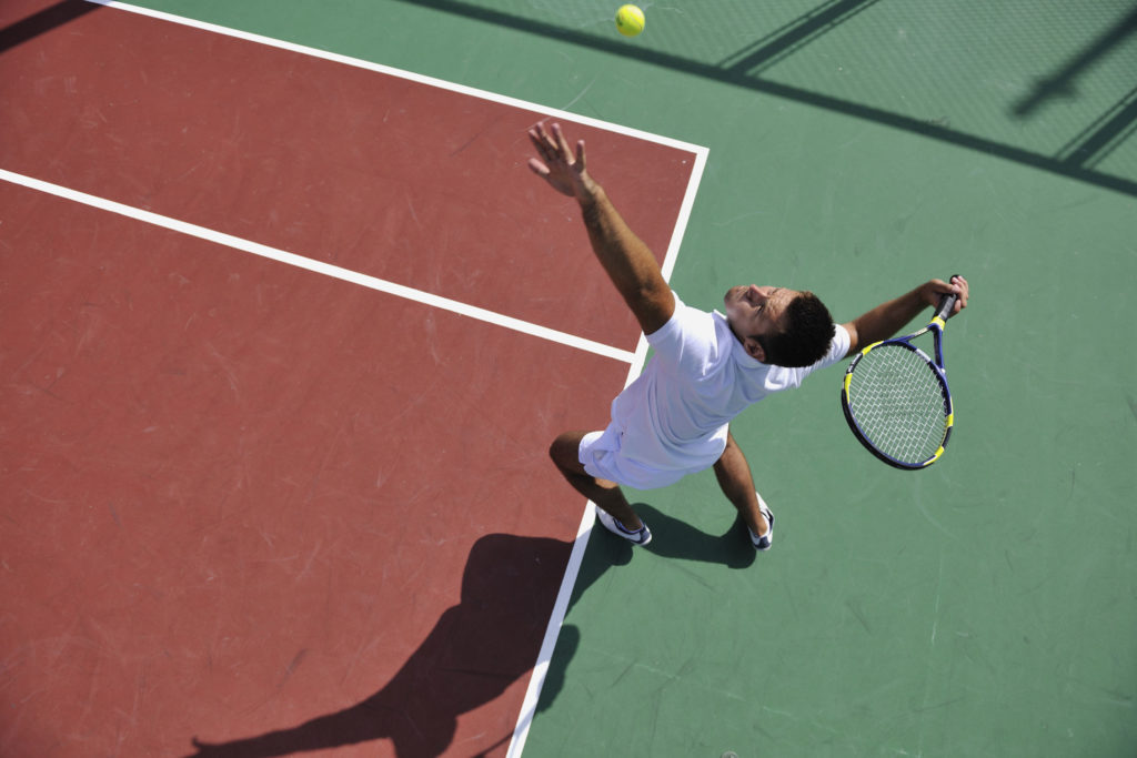 man-serving-tennis-ball-1024×683 man-serving-tennis-ball