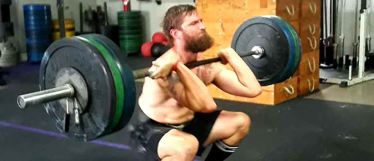 programs2 man lifting a dumbell