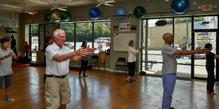 group of seniors practicing tai chi