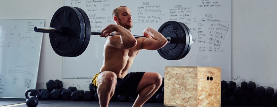 man lifting heavy weight in crossfit class