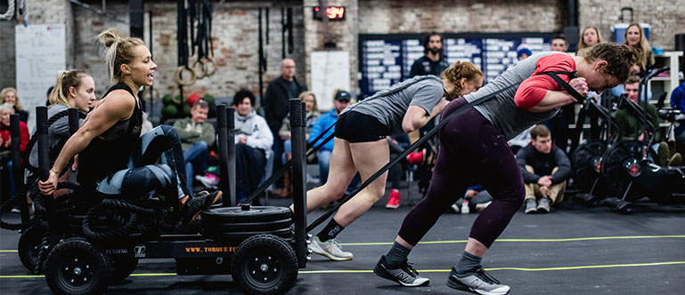 Athletes in Philadelphia crossfit training with weighted sleds