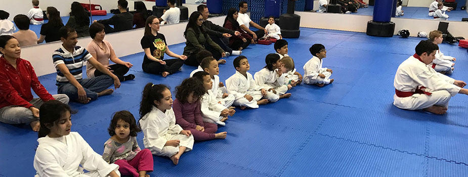 parents sitting with children at child taekwondo class in Springfield, NJ