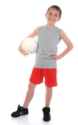 a caucasian boy holding a volleyball in a white background