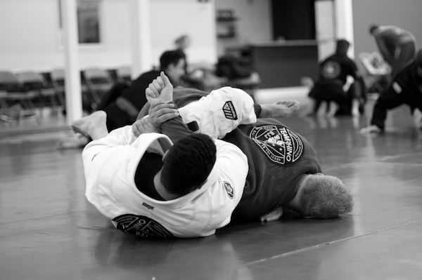 Two students from Team Rhino Gracie Jiu-Jitsu in Meridian practice skills through drills