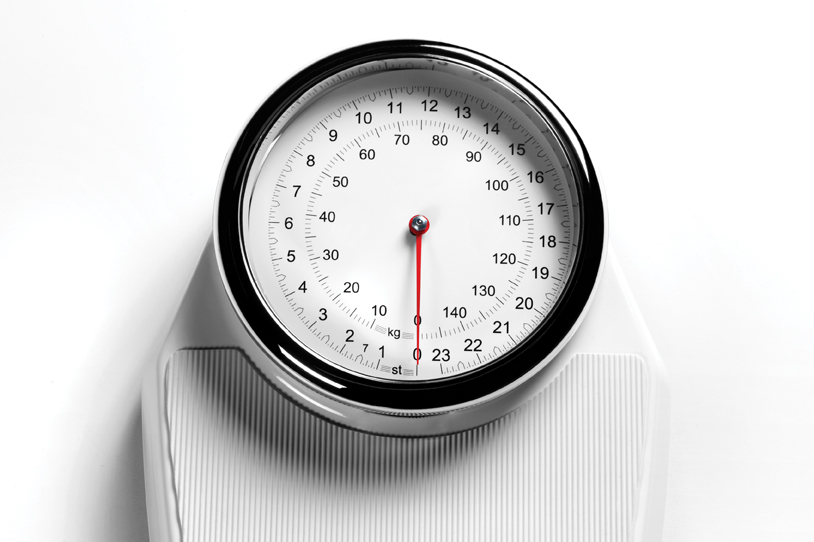 White weighing scales with copy space