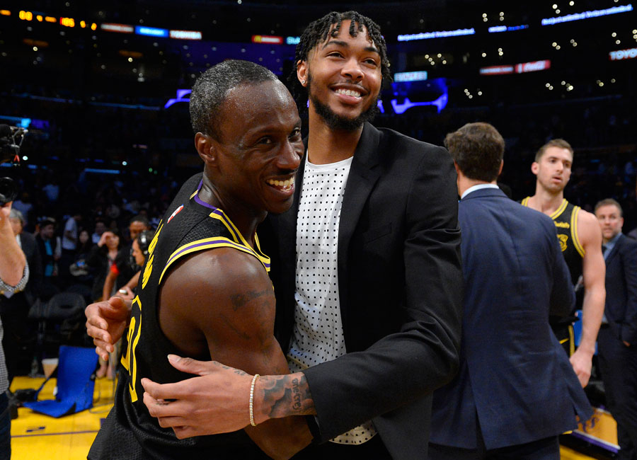 Andre Ingram hugs a fellow player after his NBA debut.