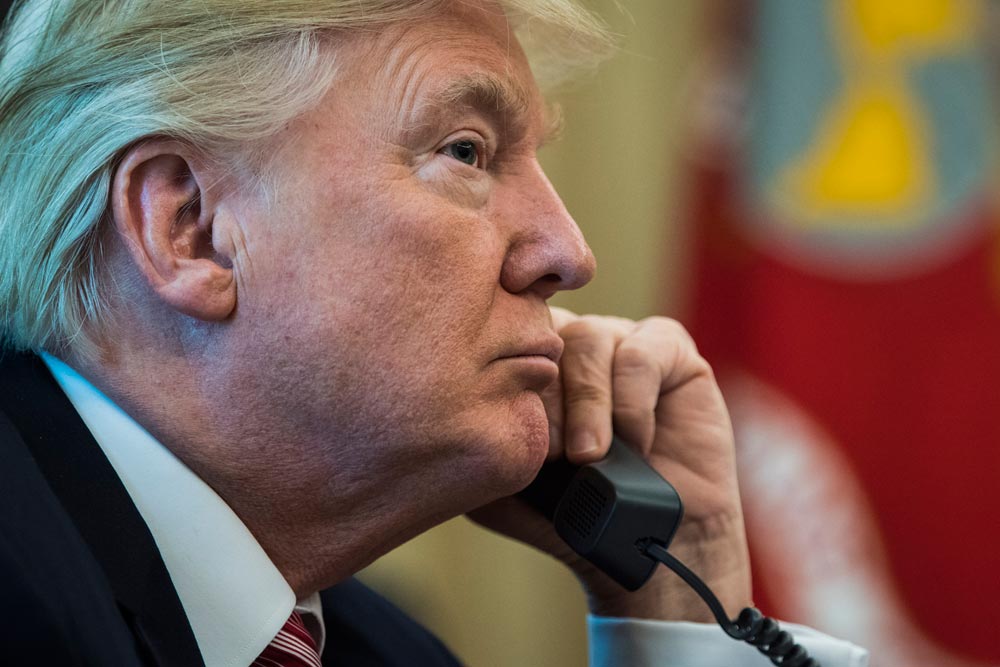 US President Donald Trump talking on telephone.