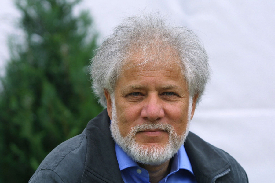 Michael Ondaatje smirking slightly.