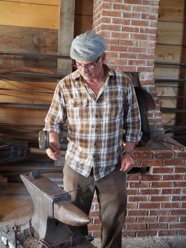 Blacksmith working at Banc de Peche.