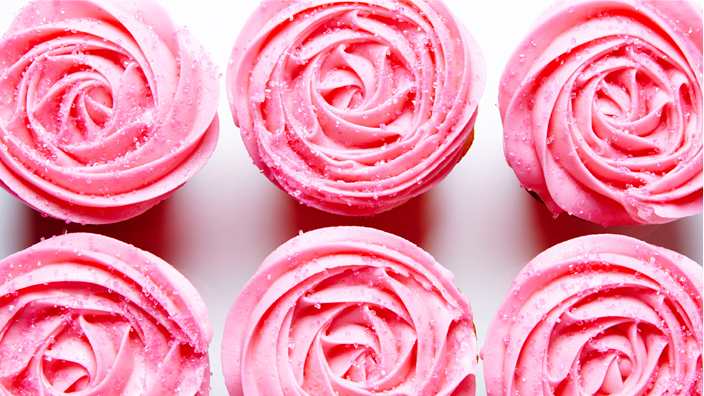 Cupcakes covered in pink icing.
