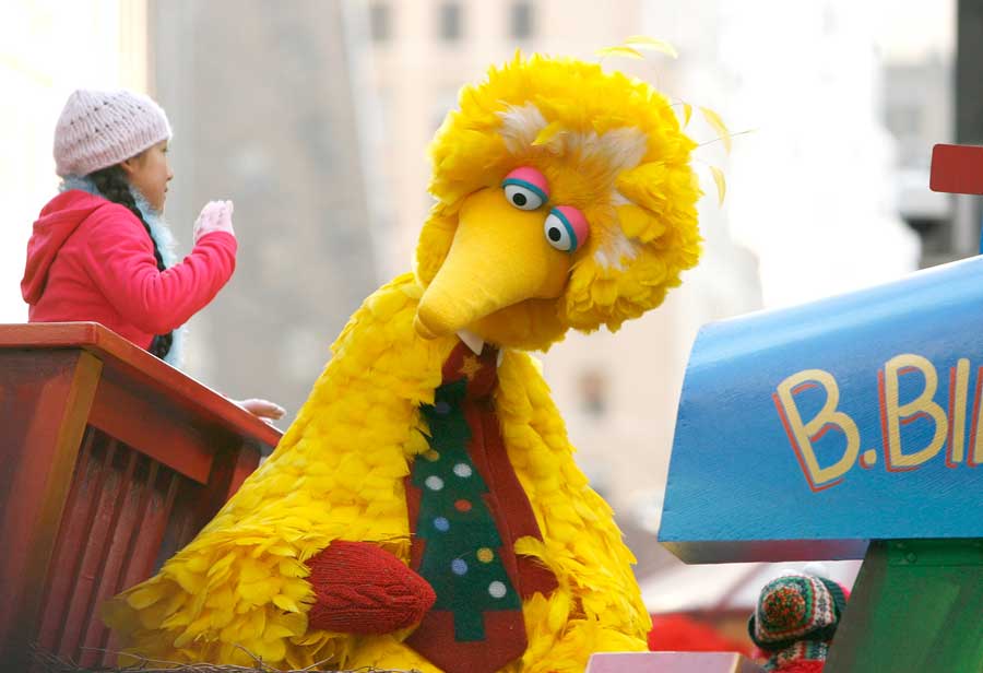 Big Bird on a float at a parade.