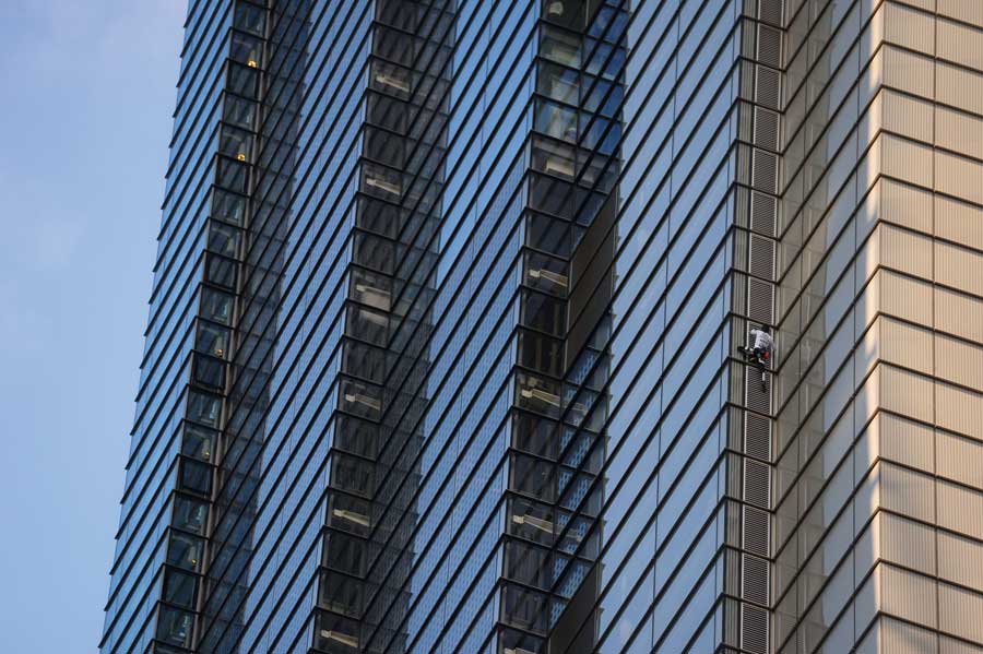 A man scaling a skyscraper.