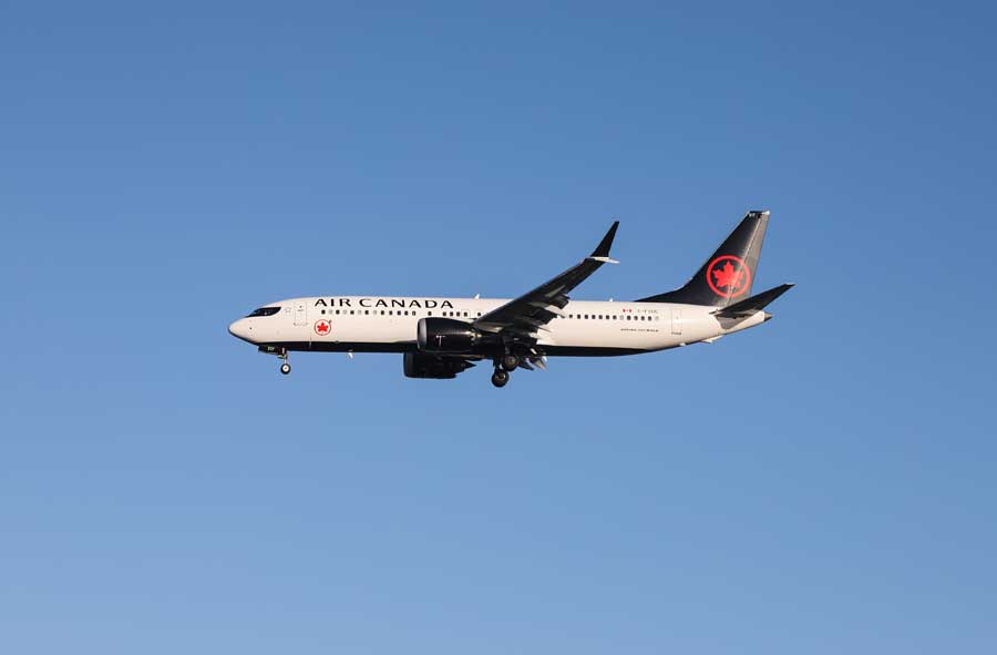 A Boeing Max 8 airplane in flight.