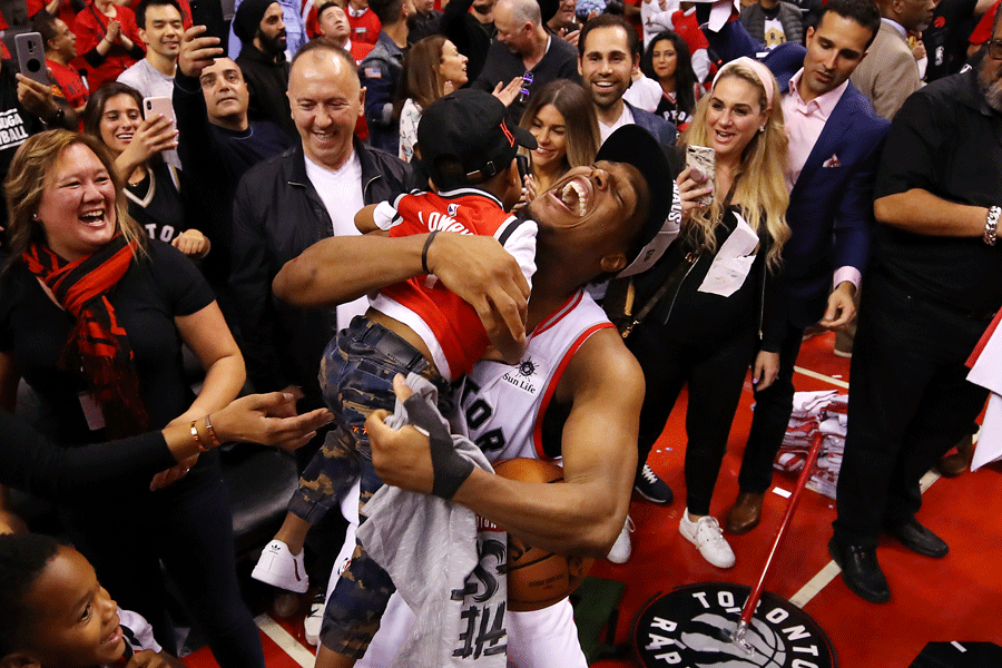 Kyle Lowry hugs his infant son after winning the Easter Conference finals.