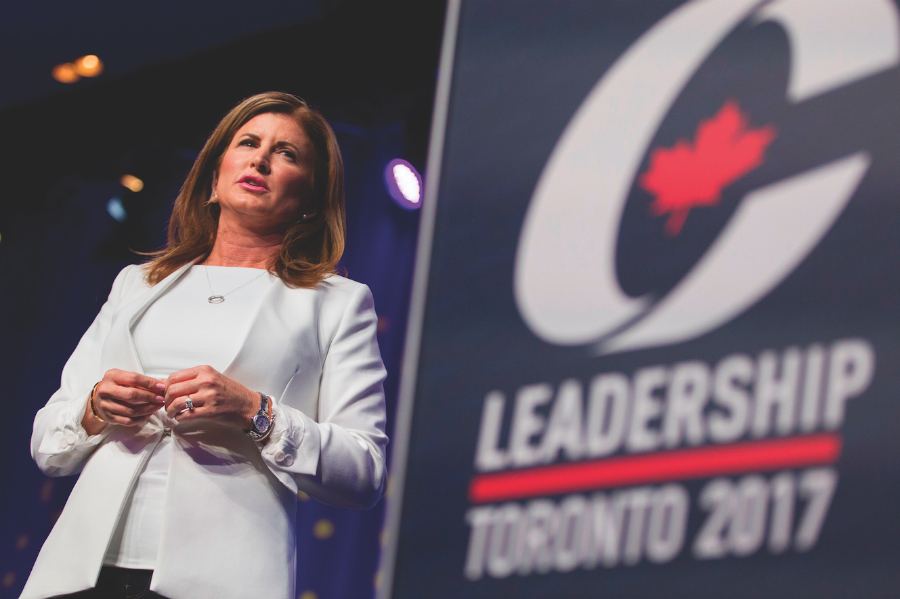 A photo of Rona Ambrose on stage at a Conservative Party event.