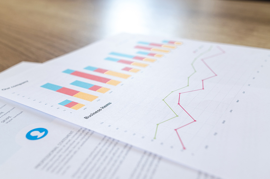 A page with various charts and graphs on it showing the up and down movement of stocks.