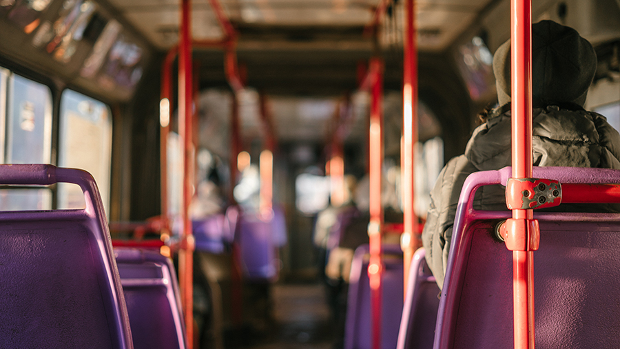 A photo of the inside of a city bus.