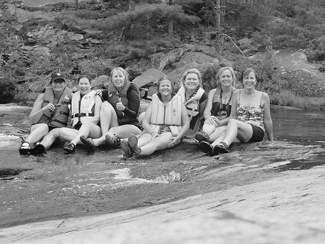 A photo of Pierce, Hartwig, Yarmoluk, Sajovic, Button, Tremble and Coccimiglio enjoying the water slide and swimming hole at High Falls.