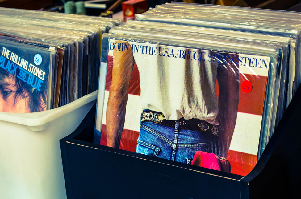 A bin of vinyl albums in a flea market