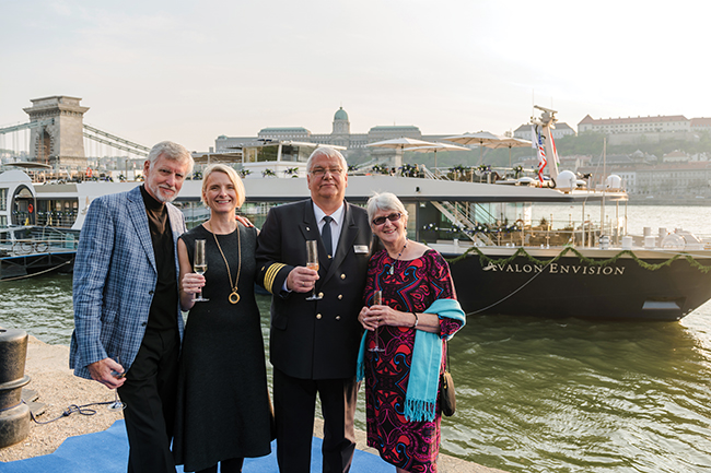A photo of Gilbert with her parents, John and Carole Gilbert, and Capt. Ralf Remus.