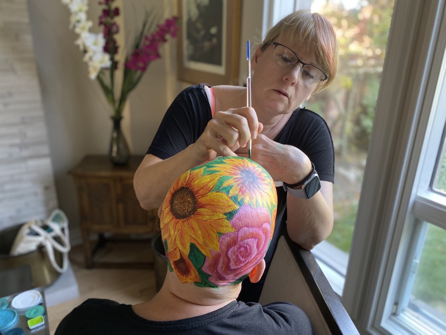 Long-time friend Susan Ambrose hard at work on Lezli's 24th head painting.