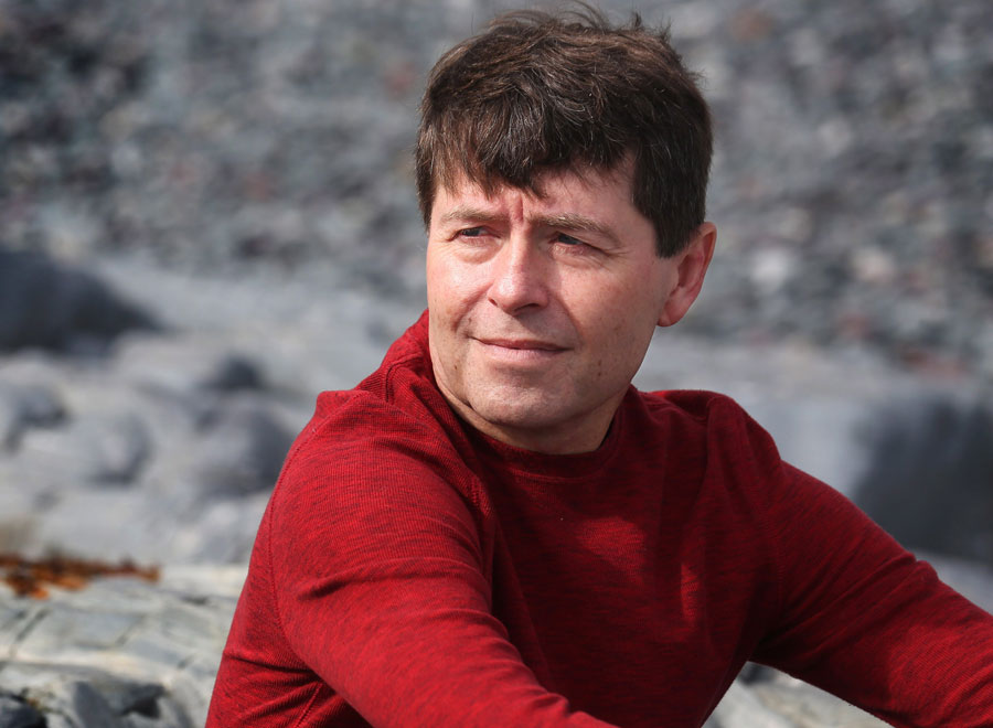 Giller Prize finalist Michael Crummey poses for a picture on Middle Cove Beach, just outside St. John’s. NL.